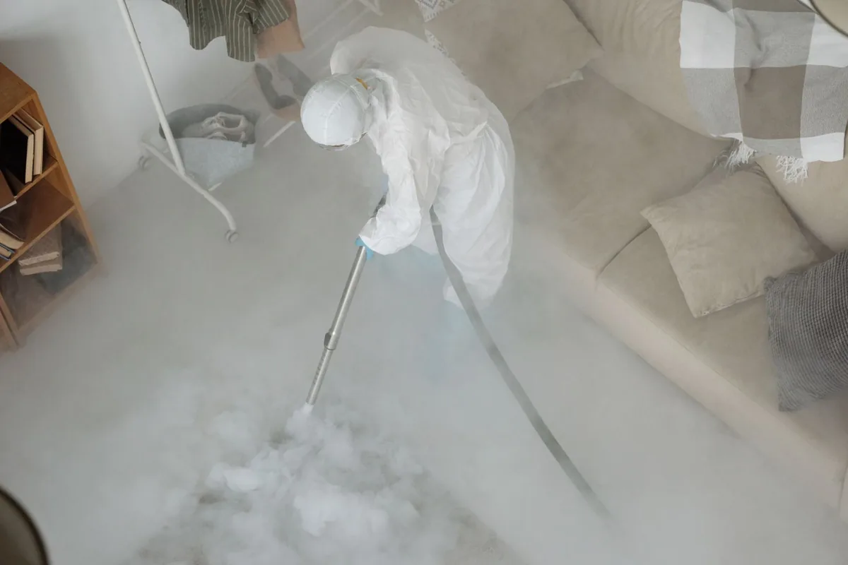 Biohazard cleanup technician in protective equipment, Crescent City, FL
